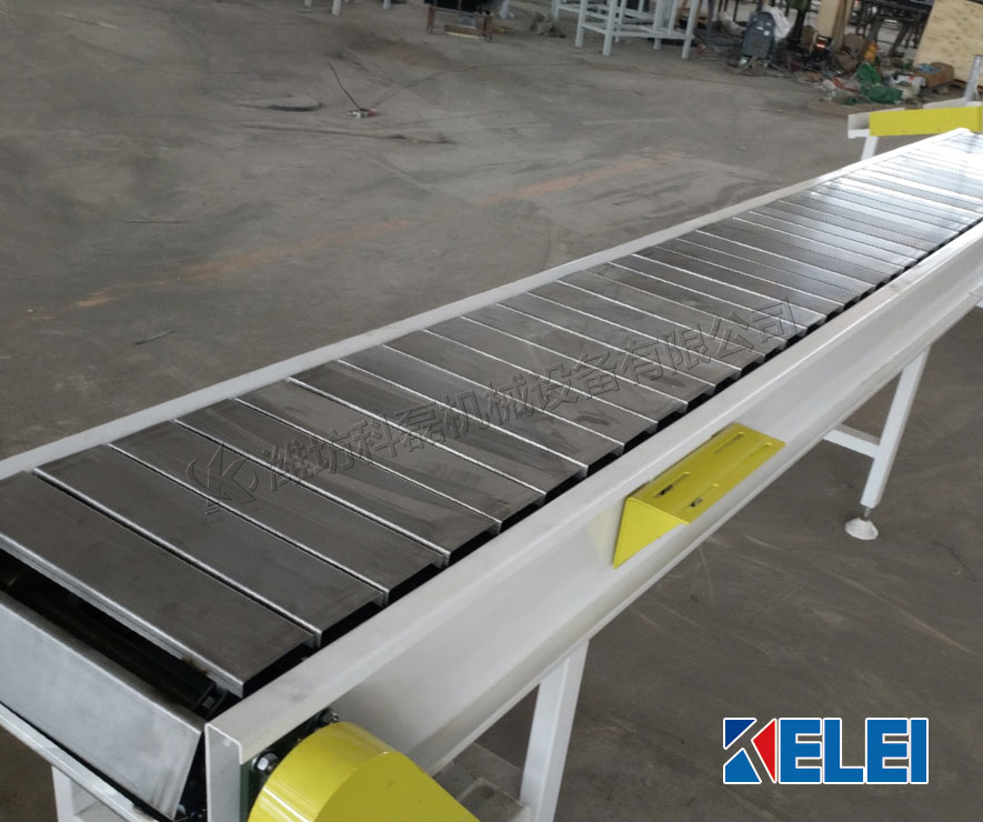 襄阳用裕(yu)橡胶制造(zao)有限公司(sī)(急速版)鏈(liàn)闆式輸送(song)機